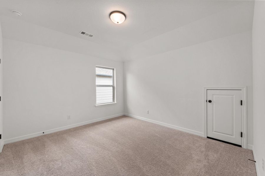 Your secondary bedroom features plush carpet, fresh paint, closet, and a large window that lets in plenty of natural lighting.