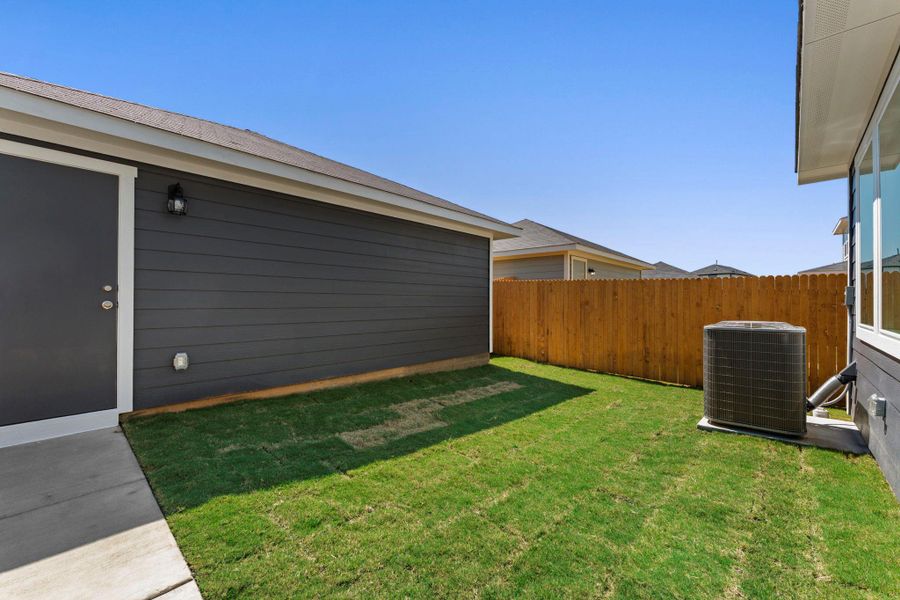 Exterior details and patio area of a home in Valverde, Bastrop (Image 21).