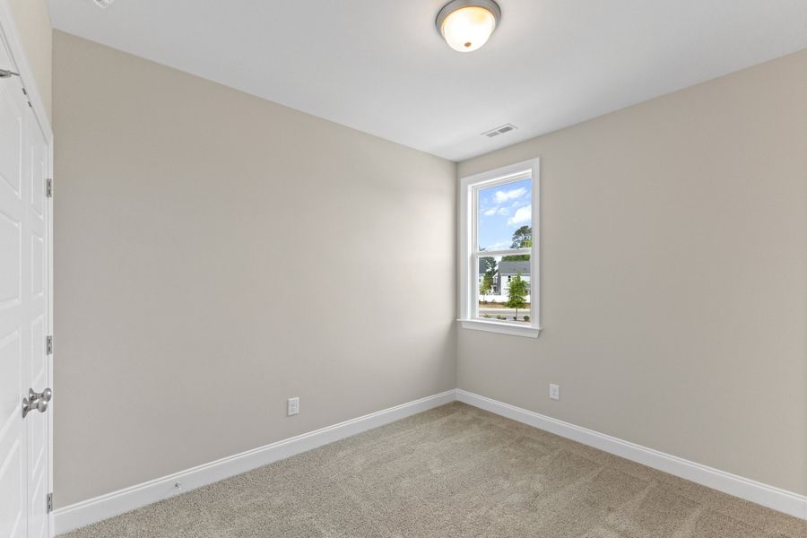 Representative unfurnished interior of a home built from the The Juniper by RobuckHomes in Kennebec Crossing, Angier (Image 105).