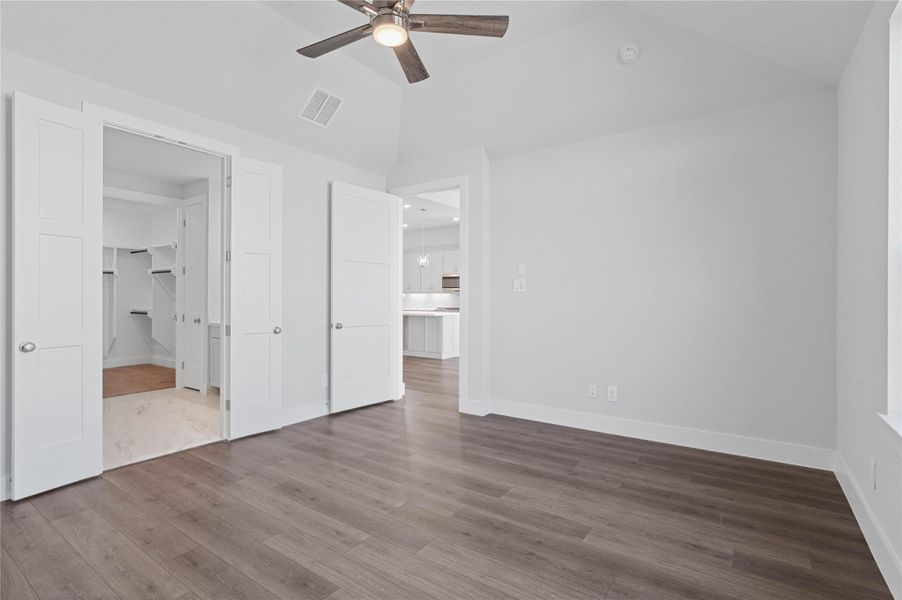 Additional view from the primary bedroom looking towards the ensuite primary bathroom and the double door entrance!