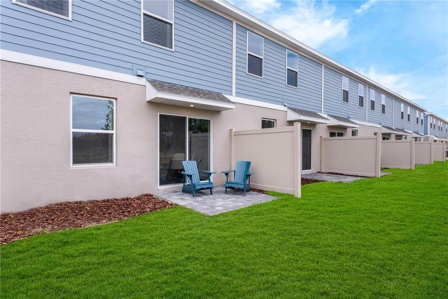 Exterior details and patio area of a home in Avalon Park Tavares Single Family Homes, Tavares (Image 20).
