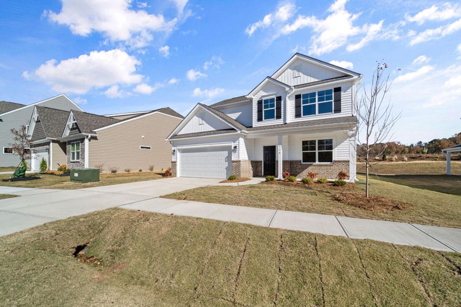 Front exterior of a new home in Monterra, Kernersville, NC, highlighting curb appeal (Image 20).