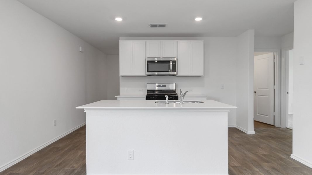 Representative furnished interior of a home built from the T30B Barton by D.R. Horton in Riverfield, Josephine (Image 5).