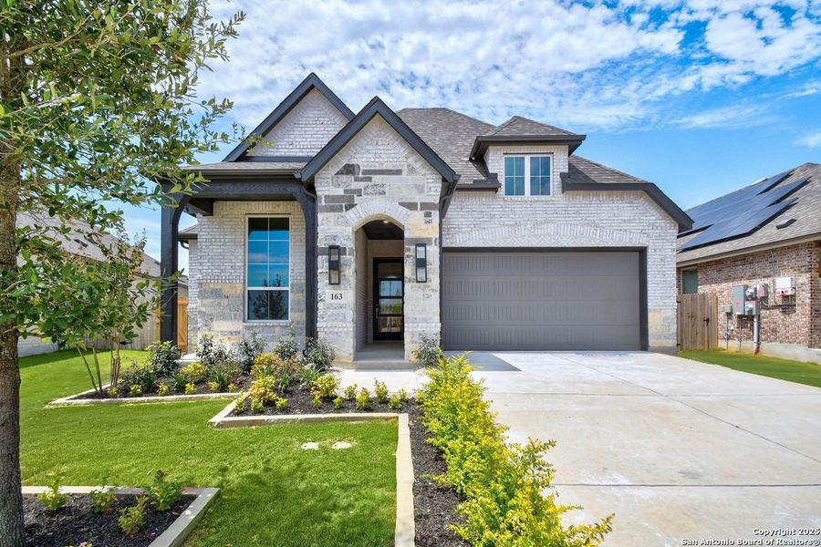 Front exterior of a new home in Alsatian Oaks: 50ft. lots, Castroville, TX, highlighting curb appeal (Image 15).