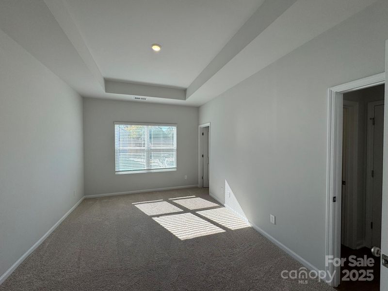 Primary Suite with 10' Boxed Tray Ceiling Primary Suite with 10' Boxed Tray Ceiling