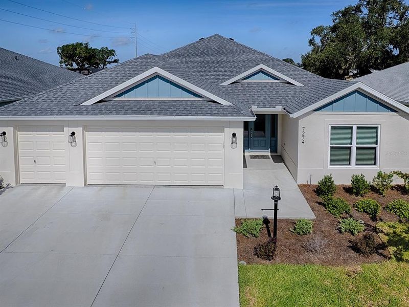 Front exterior of a new home in , The Villages, FL, highlighting curb appeal (Image 1). Front exterior of a new home in , The Villages, FL, highlighting curb appeal (Image 1).