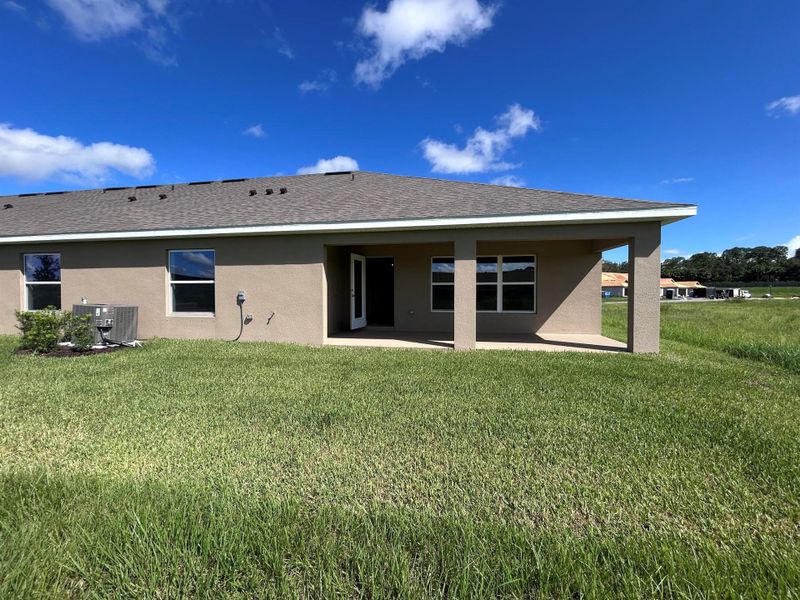 Front exterior of a new home in Waterstone Villas, Fort Pierce, FL, highlighting curb appeal (Image 23). Front exterior of a new home in Waterstone Villas, Fort Pierce, FL, highlighting curb appeal (Image 23).