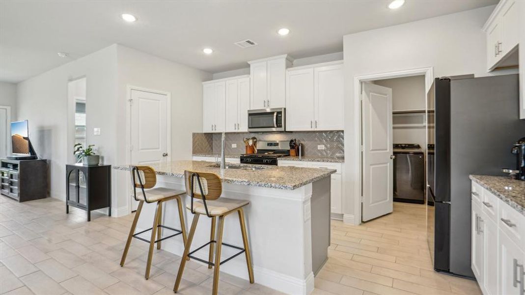 Furnished interior view inside a new home in Venetian, Weston (Image 18).