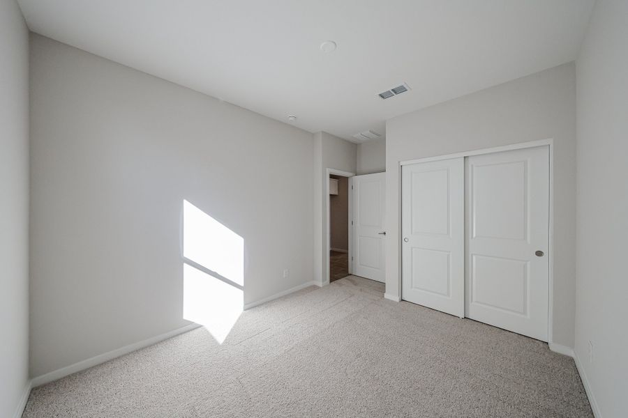 A hallway with white doors. A hallway with white doors.