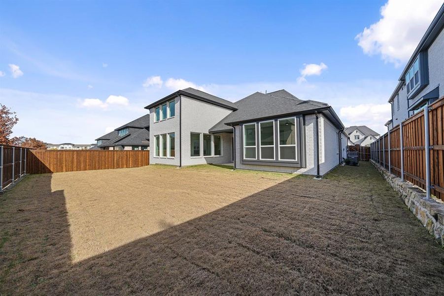 Exterior details and patio area of a home in Estates at Rockhill, Frisco (Image 26).