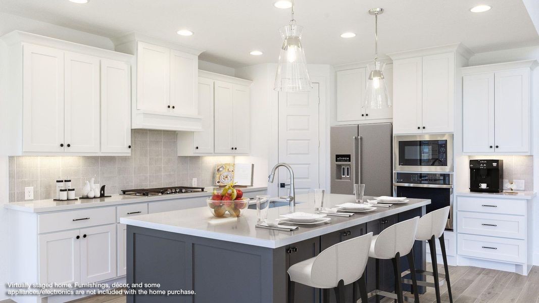 Kitchen with backsplash, recessed lighting, a kitchen breakfast bar, and white cabinets