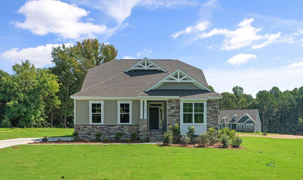 Front exterior of a new home in Redland, Advance, NC, highlighting curb appeal (Image 1). Front exterior of a new home in Redland, Advance, NC, highlighting curb appeal (Image 1).