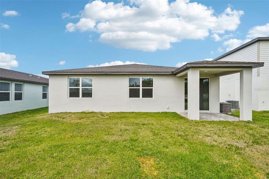 Exterior details and patio area of a home in The Reserve at Hammock Oaks - Signature Series, Lady Lake (Image 3).