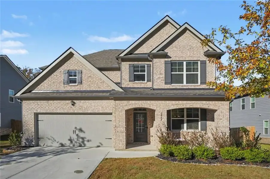 Front exterior of a new home in Butner Estates, South Fulton, GA, highlighting curb appeal (Image 2).