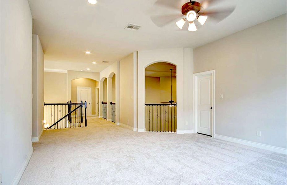 Representative unfurnished interior of a home built from the 4198 by Ravenna Homes in The Woodlands Hills 65′, Willis (Image 27).