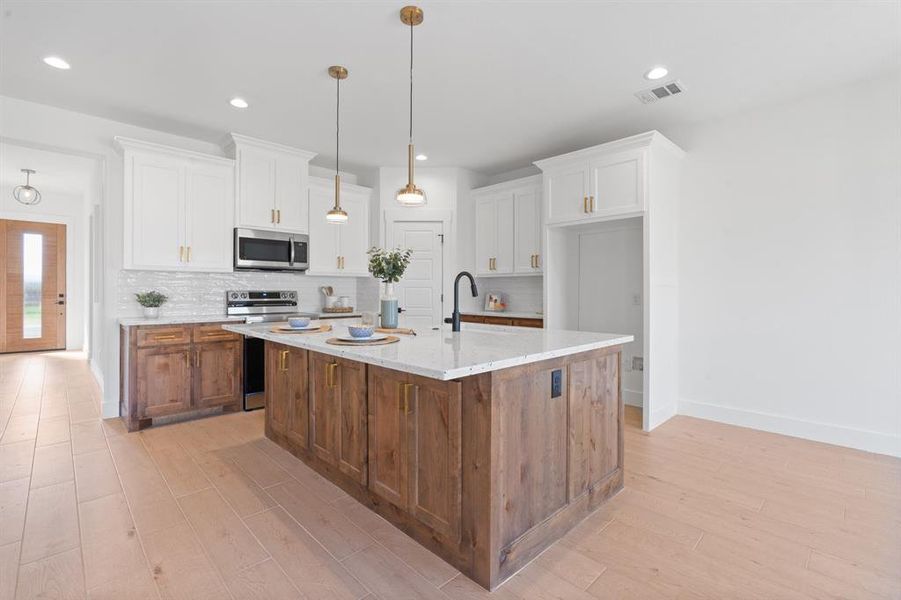 Custom cabinetry with walk-in pantry