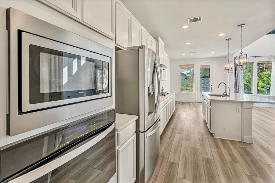 Furnished interior view inside a new home in Harper's Preserve - Classic Series, Conroe (Image 5). Furnished interior view inside a new home in Harper's Preserve - Classic Series, Conroe (Image 5).