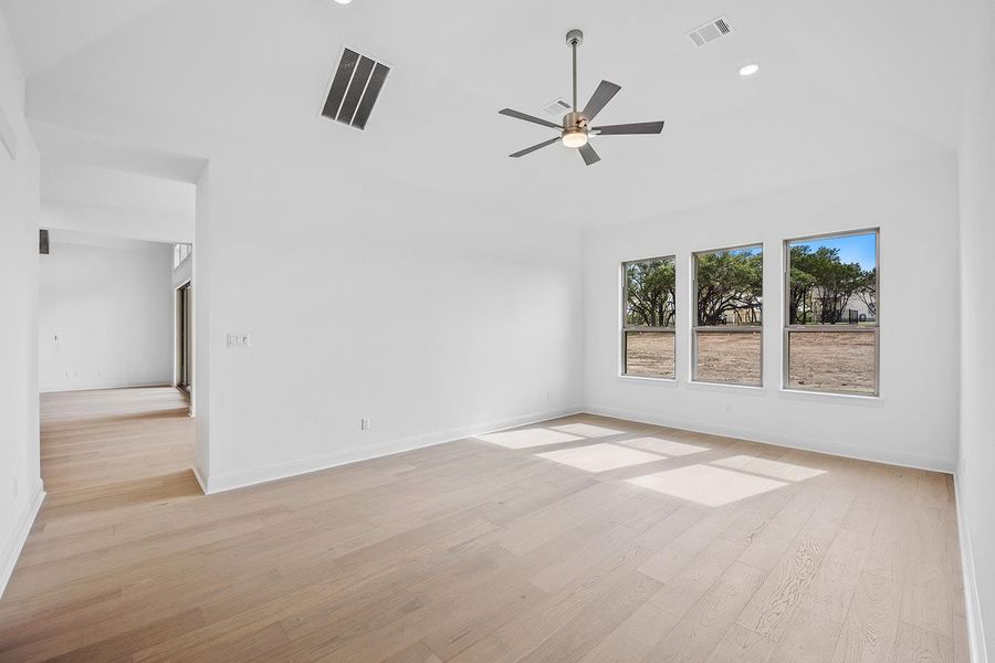 Flex room, second living, game room with light wood-type flooring, ceiling fan, lofted ceiling, and recessed lighting