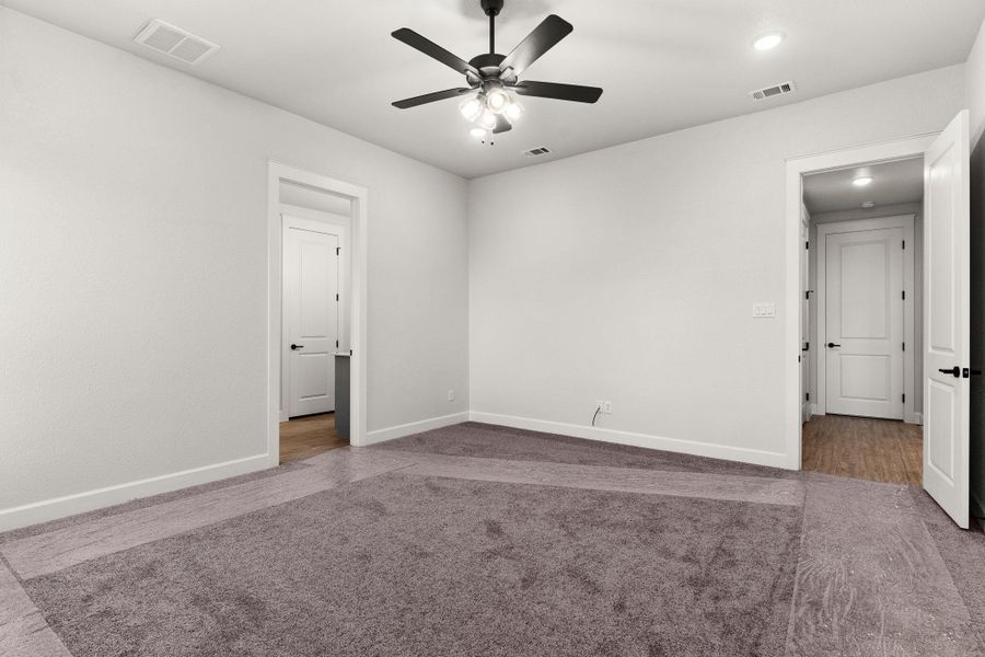Unfurnished room with dark carpet, recessed lighting, and a ceiling fan Unfurnished room with dark carpet, recessed lighting, and a ceiling fan