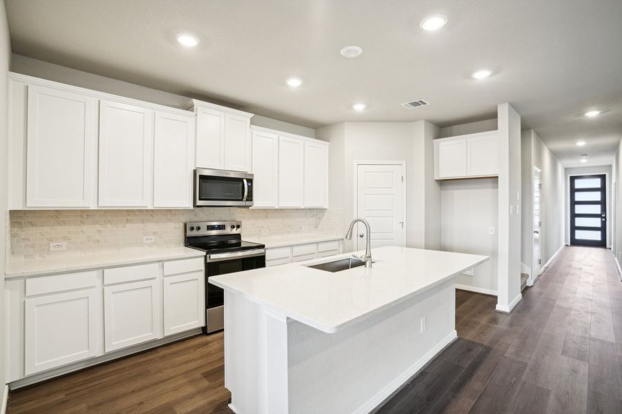 Kitchen of the Reynolds floorplan at a Meritage Homes community.