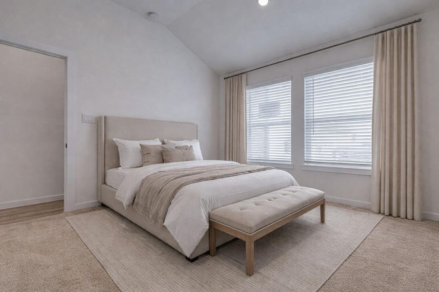 One of four spacious bedrooms, this versatile space features plush carpet, high ceilings, and oversized windows that flood the room with natural light. Ideal as a guest room, home office, or nursery, this retreat offers quiet comfort and flexibility all wrapped in a neutral palette ready for your personal touch. This photo has been virtually staged for visual reference.