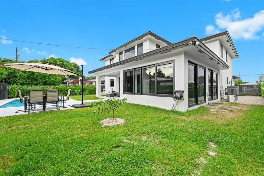 Front exterior of a new home in , Miami Springs, FL, highlighting curb appeal (Image 24).