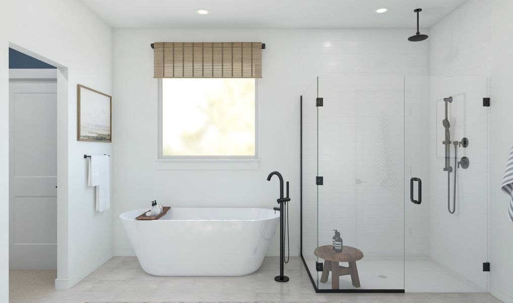 Primary bath with freestanding tub and glass shower enclosure