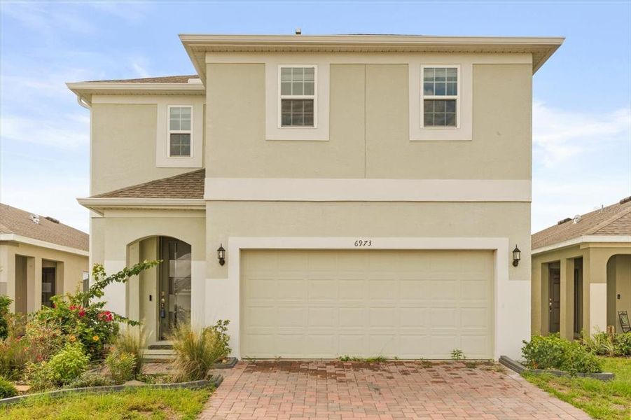 Front exterior of a new home in , Groveland, FL, highlighting curb appeal (Image 19). Front exterior of a new home in , Groveland, FL, highlighting curb appeal (Image 19).