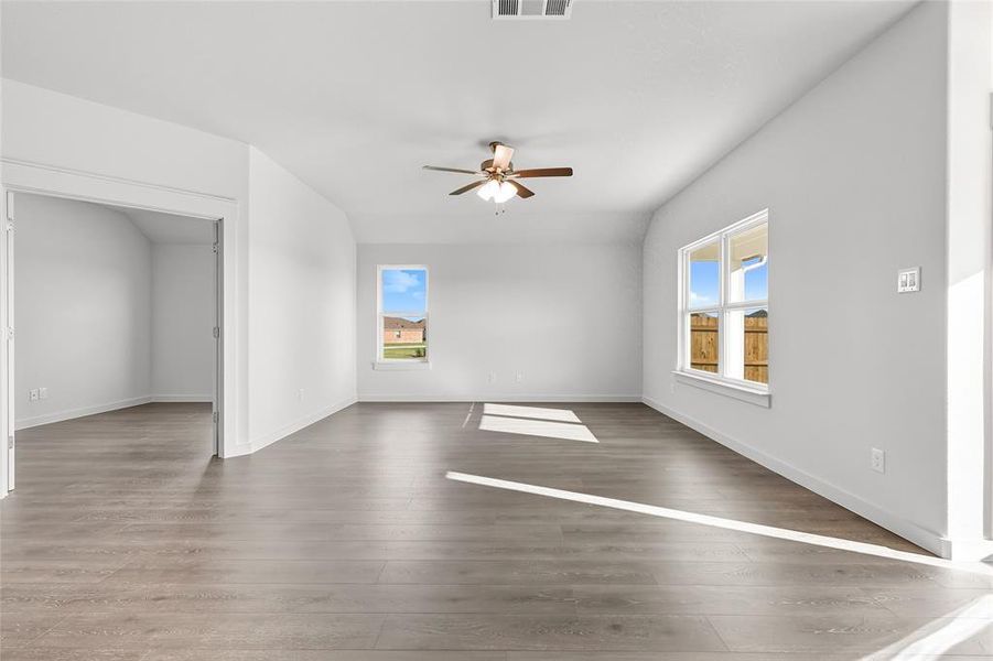 Unfurnished living room with light wood-style floors and a ceiling fan Unfurnished living room with light wood-style floors and a ceiling fan