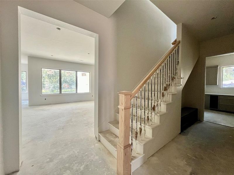 Stairway featuring concrete flooring