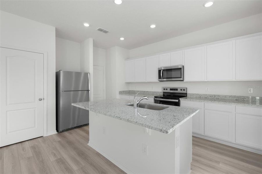 Furnished interior view inside a new home in Peach Crossings, Winter Haven (Image 5).