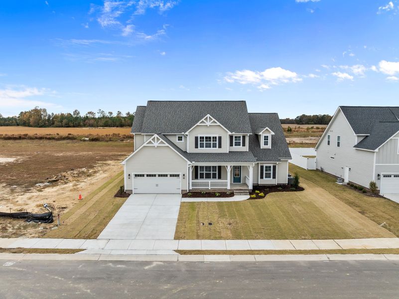 Front exterior of a new home in Eli's Ridge, Winterville, NC, highlighting curb appeal (Image 24).