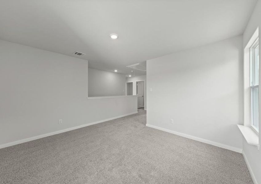 The spacious upstairs loft is the perfect space for a gameroom, playroom or craft space.