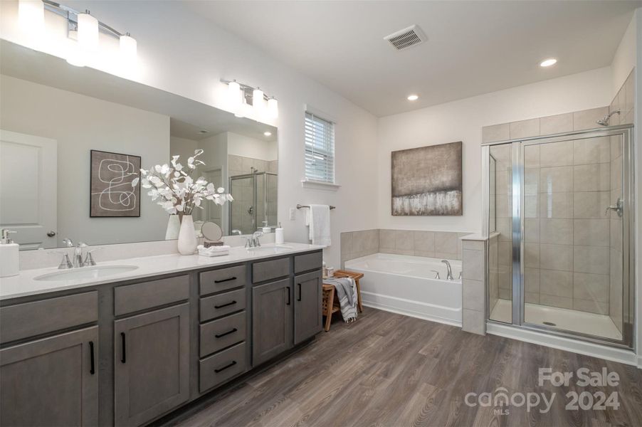 Primary bathroom with dual vanities