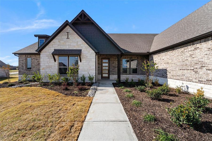 Front exterior of a new home in Creekview Addition, Van Alstyne, TX, highlighting curb appeal (Image 22). Front exterior of a new home in Creekview Addition, Van Alstyne, TX, highlighting curb appeal (Image 22).