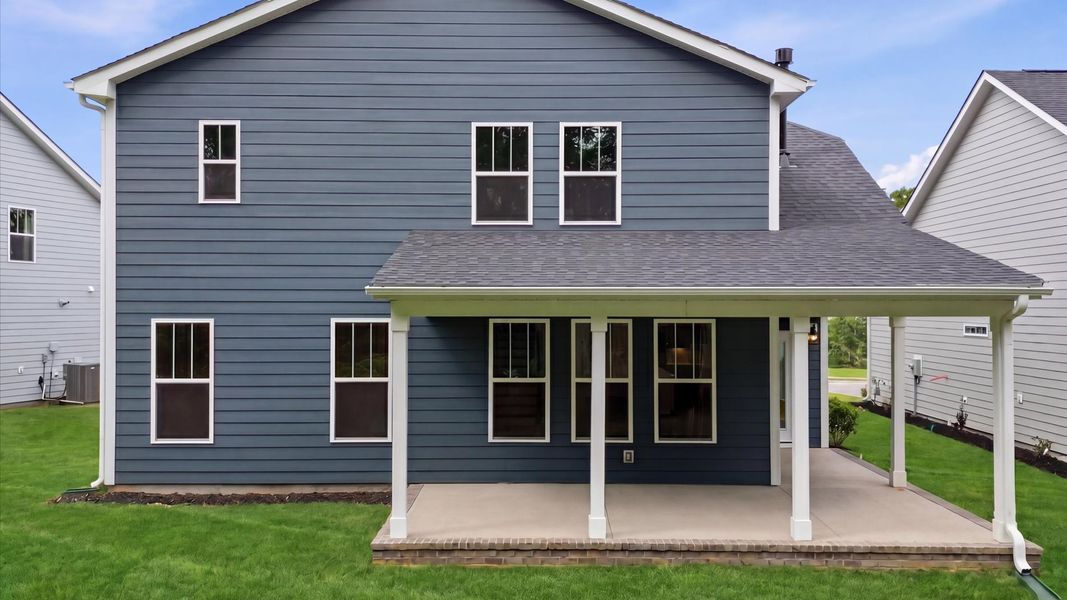 Accomplished exterior with a spacious rear porch that blends comfort and style