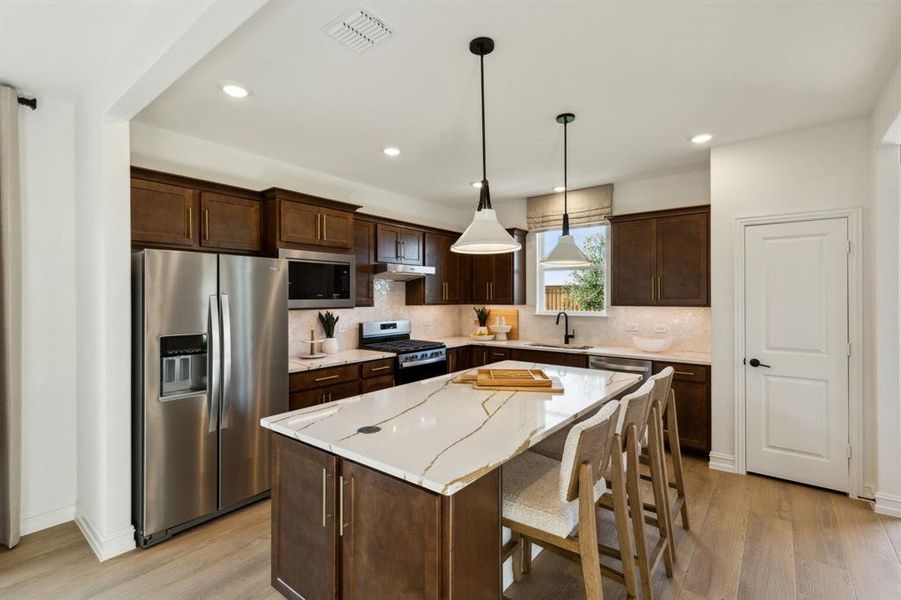 *Model Representation - Spacious kitchen with eat-in bartop island