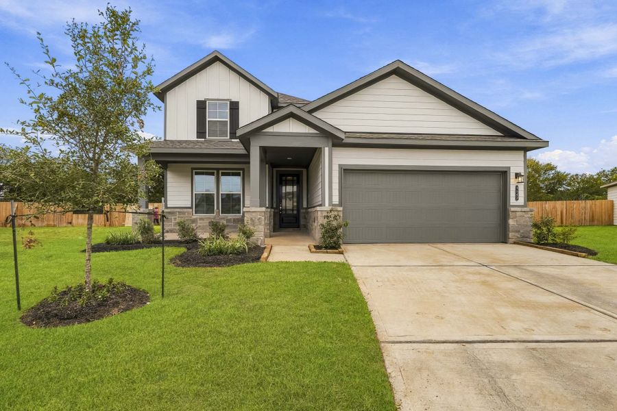 Front exterior of a new home in Fulshear Junction, Fulshear, TX, highlighting curb appeal (Image 1). Front exterior of a new home in Fulshear Junction, Fulshear, TX, highlighting curb appeal (Image 1).