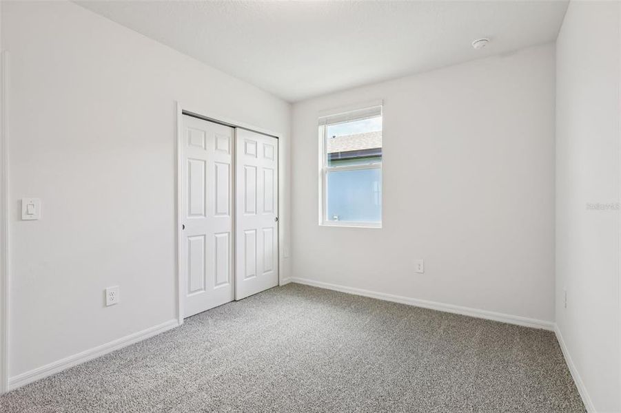 Spacious, unfurnished interior of a new home in Lake Deer Estates - Signature Series, Poinciana (Image 27).