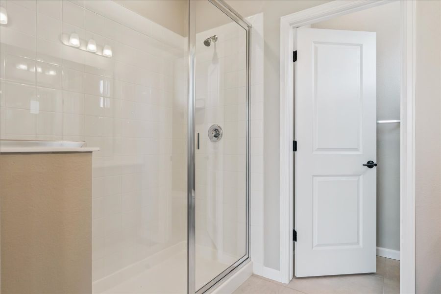 A bathroom with a glass shower.