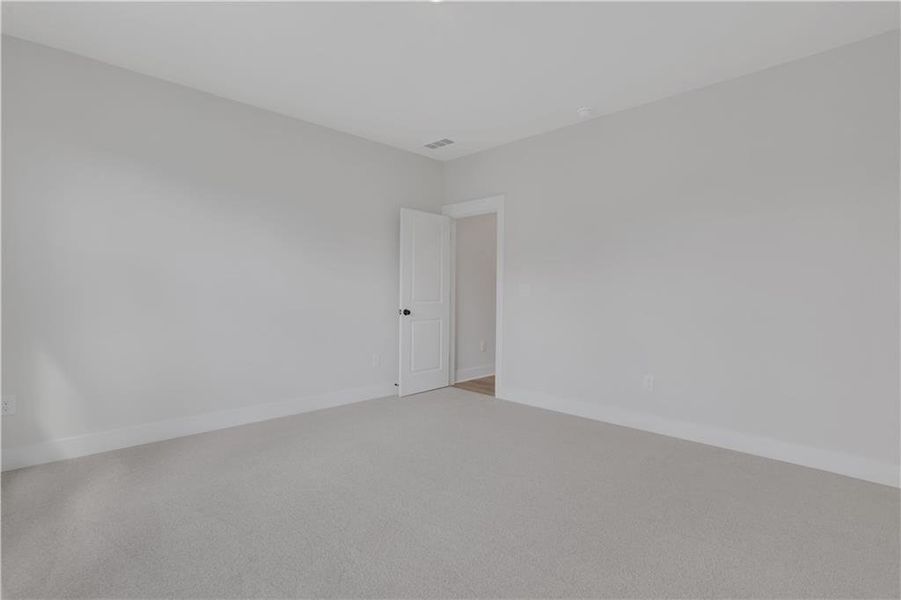 Spacious, unfurnished interior of a new home in The Paddocks at Doc Hughes, Buford (Image 33).