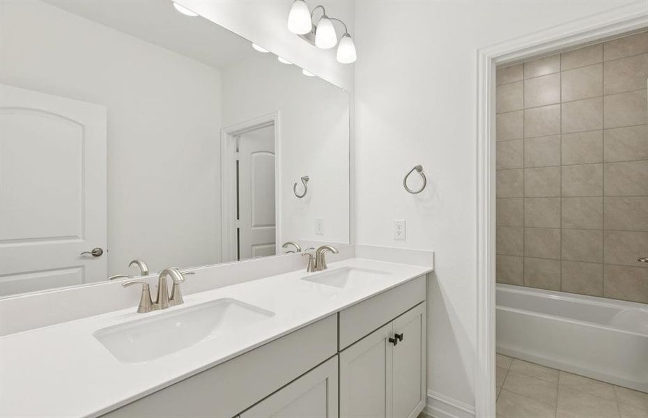 Stylish secondary bath with high-end fixtures  *Real home pictured