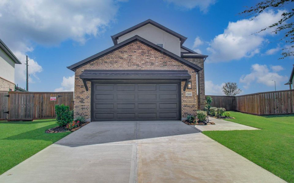 Front exterior of a new home in , Richmond, TX, highlighting curb appeal (Image 2). Front exterior of a new home in , Richmond, TX, highlighting curb appeal (Image 2).