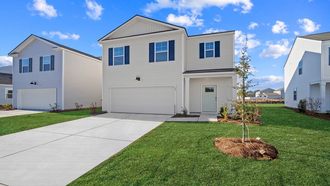 Front exterior of a new home in The Retreat at East Argent, Ridgeland, SC, highlighting curb appeal (Image 23).