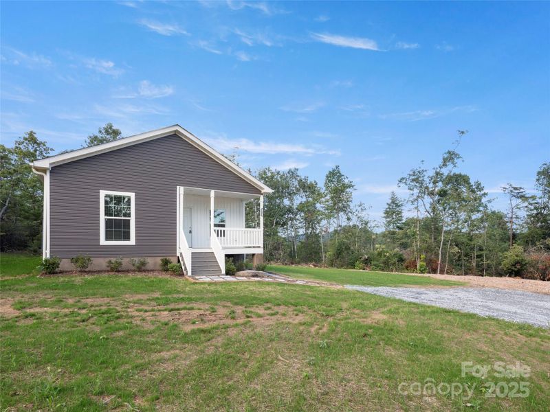 Front exterior of a new home in , Hendersonville, NC, highlighting curb appeal (Image 18).