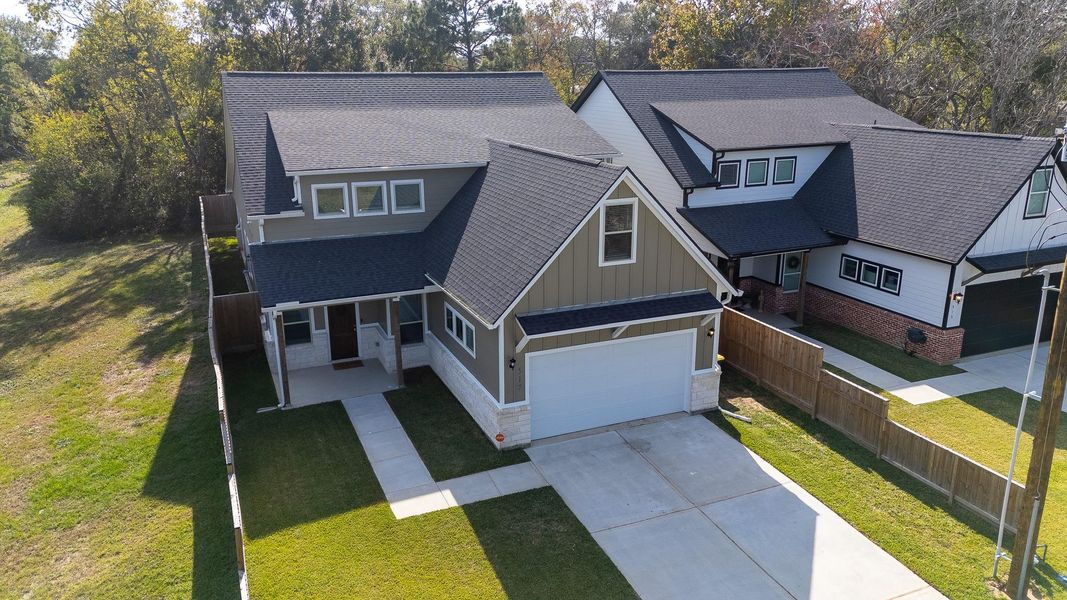 Front exterior of a new home in , Tomball, TX, highlighting curb appeal (Image 25).
