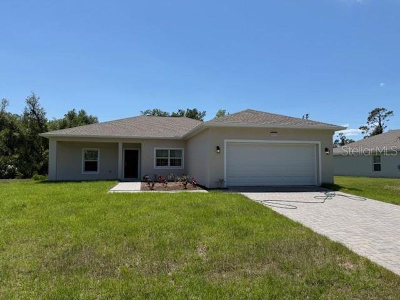 Front exterior of a new home in , Port Charlotte, FL, highlighting curb appeal (Image 1). Front exterior of a new home in , Port Charlotte, FL, highlighting curb appeal (Image 1).