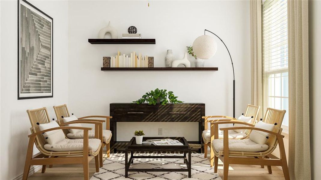 Living area featuring light wood-type flooring and a healthy amount of sunlight