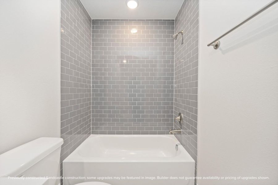 The en suite bathroom charms, radiating a serene ambiance that beautifully complements its tub/shower combo. The en suite bathroom charms, radiating a serene ambiance that beautifully complements its tub/shower combo.