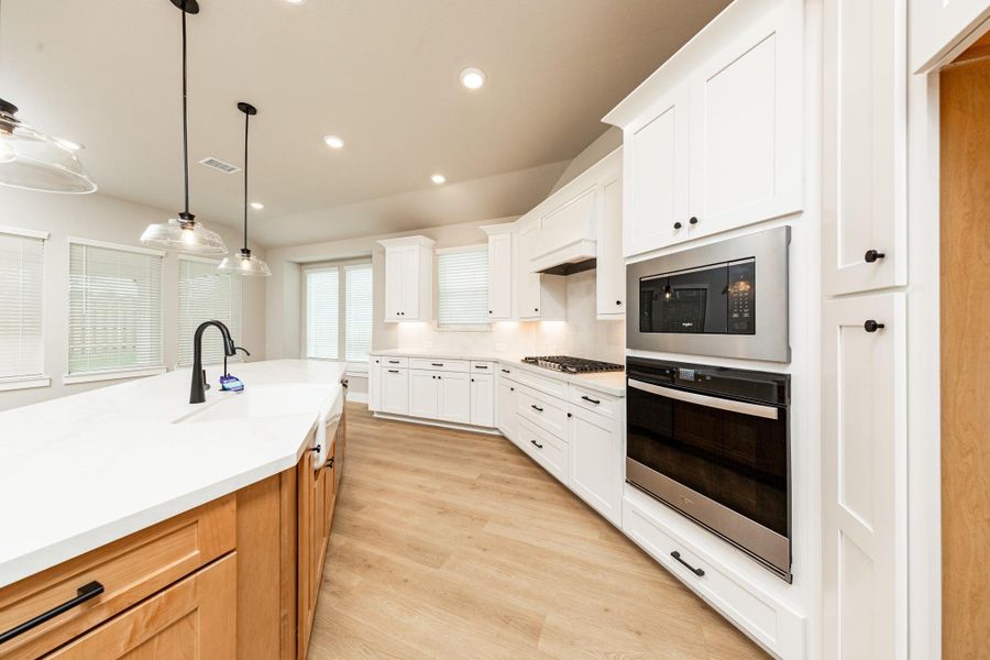 Discover the perfect blend of style and function in this modern kitchen, ready for your next culinary adventure. Equipped with high-end, stainless steel appliances, including a gas cooktop, built-in oven, and microwave. Discover the perfect blend of style and function in this modern kitchen, ready for your next culinary adventure. Equipped with high-end, stainless steel appliances, including a gas cooktop, built-in oven, and microwave.